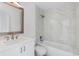 Bright bathroom with a soaking tub, shower combo, and white marble tile surround at 1684 Pintail Way, Sarasota, FL 34231