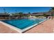 Inviting community pool surrounded by brick pavers and lounge chairs, ideal for relaxation at 1684 Pintail Way, Sarasota, FL 34231