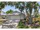 Charming home featuring a two-car garage, beautiful landscaping, and a welcoming brick driveway at 1684 Pintail Way, Sarasota, FL 34231