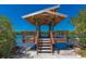 Picturesque waterfront gazebo, offering stunning views and serene relaxation by the water at 1684 Pintail Way, Sarasota, FL 34231
