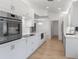 Sleek modern kitchen featuring stainless steel appliances, ample counter space, and recessed lighting at 1684 Pintail Way, Sarasota, FL 34231