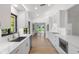 Bright, modern kitchen with white cabinetry, sleek countertops, and stainless steel appliances at 1684 Pintail Way, Sarasota, FL 34231