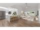 Bright, open-concept living room and kitchen with modern decor and ample natural light at 1684 Pintail Way, Sarasota, FL 34231