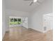 Open concept living room features bright natural light, new flooring, and an open layout at 1684 Pintail Way, Sarasota, FL 34231