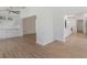 Open-concept living room showcasing wood-look flooring, white trim, and expansive views at 1684 Pintail Way, Sarasota, FL 34231