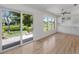 Bright living space with large sliding doors leading to outdoor views, adjacent to modern kitchen at 1684 Pintail Way, Sarasota, FL 34231