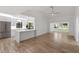 Open-concept living space connecting a contemporary kitchen to a bright, airy living room at 1684 Pintail Way, Sarasota, FL 34231