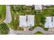 Aerial view of charming villas with well-manicured lawns and private driveways at 20 Idle Sands Dr, Venice, FL 34293