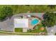 Aerial view of community pool, hot tub, and gathering area with ample parking at 20 Idle Sands Dr, Venice, FL 34293