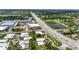 Community aerial view of homes and pond, located near shopping and dining at 20 Idle Sands Dr, Venice, FL 34293