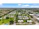 Expansive aerial view of a vibrant residential neighborhood dotted with serene ponds and lush greenery at 20 Idle Sands Dr, Venice, FL 34293