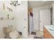 Bathroom showcasing a toilet, shower with stylish shower curtain and plenty of shelf space at 20 Idle Sands Dr, Venice, FL 34293
