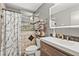 Modern bathroom with tile floors, new vanity, and updated fixtures at 20 Idle Sands Dr, Venice, FL 34293