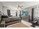 Modern bedroom with a gray color scheme, tile floors, and contemporary furnishings at 20 Idle Sands Dr, Venice, FL 34293