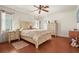 Comfortable bedroom with wood floors, a queen-sized bed, and neutral decor at 20 Idle Sands Dr, Venice, FL 34293