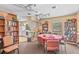 Community library with books, table, and chairs, leading to a kitchen at 20 Idle Sands Dr, Venice, FL 34293