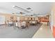 Large community room with neutral colors, ceiling fans, and ample seating at 20 Idle Sands Dr, Venice, FL 34293
