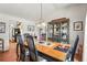 Inviting dining room featuring hardwood floors, a chandelier, and a decorative china cabinet at 20 Idle Sands Dr, Venice, FL 34293