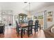 Elegant dining room featuring hardwood floors and sliding glass doors at 20 Idle Sands Dr, Venice, FL 34293