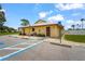 Exterior view of community gathering center with handicap parking at 20 Idle Sands Dr, Venice, FL 34293
