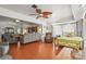 Open living room and bedroom area featuring lots of warm colors and natural light at 20 Idle Sands Dr, Venice, FL 34293
