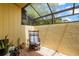 This is a patio featuring brick flooring, a neutral wall, and a rocking chair at 20 Idle Sands Dr, Venice, FL 34293