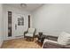 Inviting covered porch area with a comfortable seating arrangement and tile flooring at 20 Idle Sands Dr, Venice, FL 34293