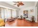 Cozy sitting room with hardwood floors, comfortable chairs, and natural light at 20 Idle Sands Dr, Venice, FL 34293