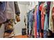 Spacious walk-in closet featuring built-in shelving for organized storage at 20 Idle Sands Dr, Venice, FL 34293