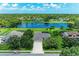 Beautiful aerial view of home with a spacious yard and a serene lake in the backyard at 208 147Th Ne St, Bradenton, FL 34212