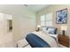 Comfortable bedroom with plush carpet, ample storage with a large closet, and pleasing decorative touches at 208 147Th Ne St, Bradenton, FL 34212