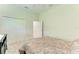 Spacious bedroom featuring a closet, neutral carpet, and ceiling fan at 208 147Th Ne St, Bradenton, FL 34212