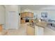 Spacious kitchen featuring granite countertops, stainless steel appliances, and a functional layout for cooking and entertaining at 208 147Th Ne St, Bradenton, FL 34212