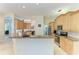 Well-lit kitchen showcasing stainless steel appliances, granite countertops, and an open layout for seamless entertaining at 208 147Th Ne St, Bradenton, FL 34212