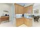 Bright kitchen with stainless steel appliances, granite countertops, and wooden cabinets at 208 147Th Ne St, Bradenton, FL 34212
