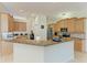 Open kitchen design with light wood cabinets, granite countertops, and modern appliances, perfect for culinary enthusiasts at 208 147Th Ne St, Bradenton, FL 34212