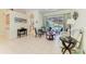 Bright living room featuring neutral tiled floors, sliding glass doors, and comfortable seating at 208 147Th Ne St, Bradenton, FL 34212