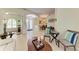 Inviting living room featuring tile floors, neutral tones, and elegant decor, showcasing an open concept design at 208 147Th Ne St, Bradenton, FL 34212
