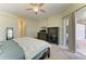 Spacious bedroom featuring soft carpet, neutral colors, and access to the back porch at 208 147Th Ne St, Bradenton, FL 34212