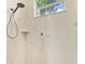A renovated shower featuring custom tile work and a window bringing in light at 208 147Th Ne St, Bradenton, FL 34212