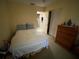 Cozy bedroom with bed, dresser, and closet at 2115 Temple St, Sarasota, FL 34239