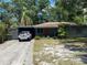 Charming single-story home with a quaint front yard and covered parking, perfect for comfortable living at 2115 Temple St, Sarasota, FL 34239