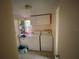 Functional laundry room with washer, dryer, and storage space at 2115 Temple St, Sarasota, FL 34239