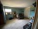 Inviting living room with comfortable recliner and natural light at 2115 Temple St, Sarasota, FL 34239