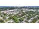 Aerial view showcases the community amidst lush greenery, offering a glimpse of the nearby city skyline at 2220 Bahia Vista St # G4, Sarasota, FL 34239