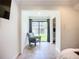 Bedroom featuring a sitting area with a sliding glass door and a doorway at 2220 Bahia Vista St # G4, Sarasota, FL 34239