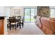 Open-concept dining area adjacent to the living room, illuminated by natural light at 2220 Bahia Vista St # G4, Sarasota, FL 34239