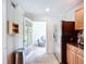 A kitchen with tile flooring, black granite countertops, stainless steel appliances and access to the living room at 2220 Bahia Vista St # G4, Sarasota, FL 34239