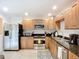 The kitchen has stainless steel appliances and granite countertops along with neutral colors that will match any decor at 2220 Bahia Vista St # G4, Sarasota, FL 34239
