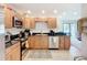 A kitchen has stainless steel appliances and granite countertops along with neutral colors that will match any decor at 2220 Bahia Vista St # G4, Sarasota, FL 34239
